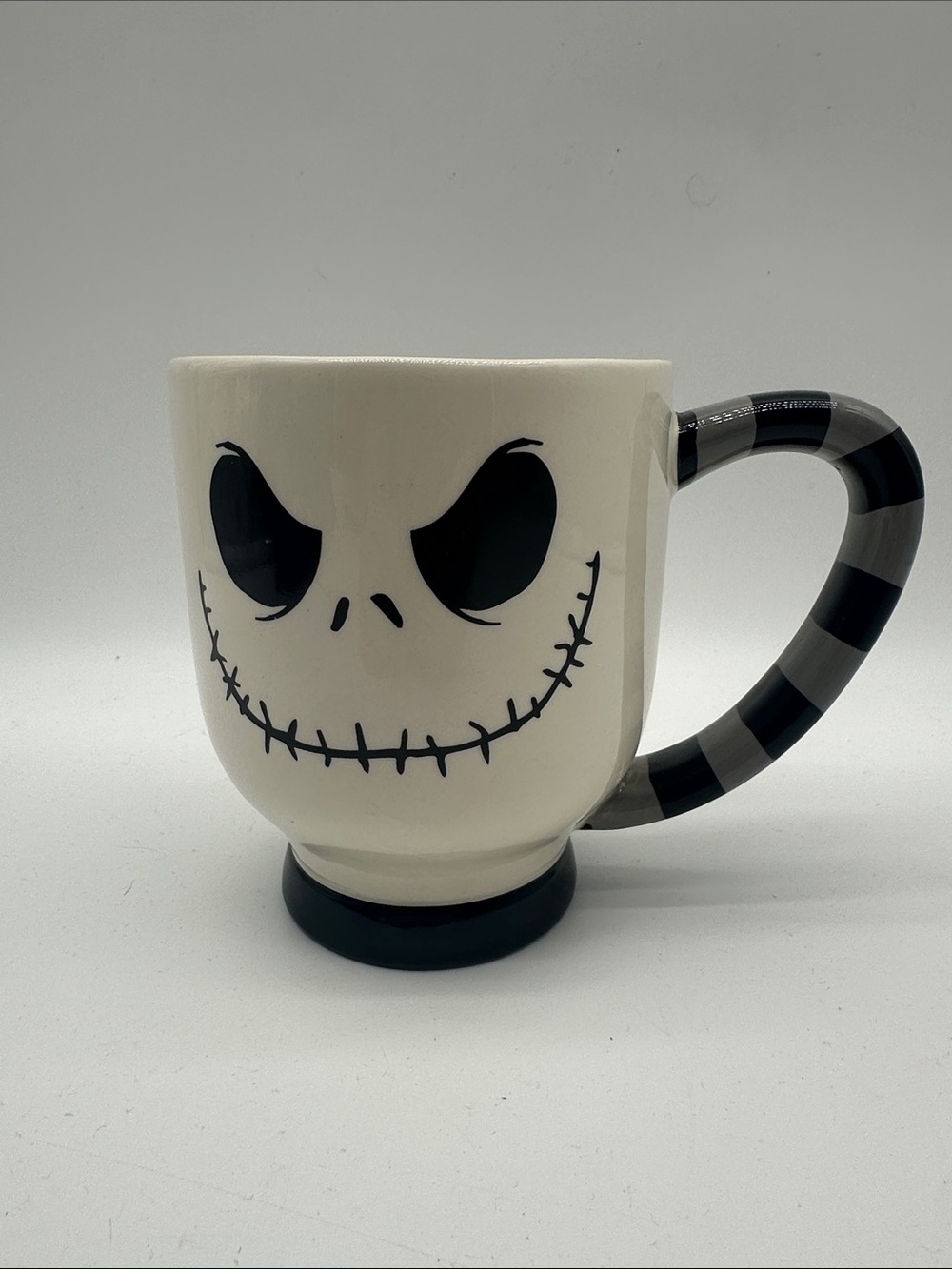 Disney Parks Jack Skellington Face Ceramic Mug with Black Striped Handle